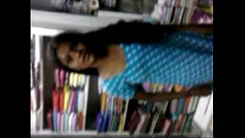 indian young student relaxed on inside of book shop wowmoyback